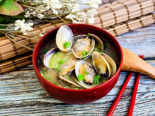 Shellfish soup in a red bowl